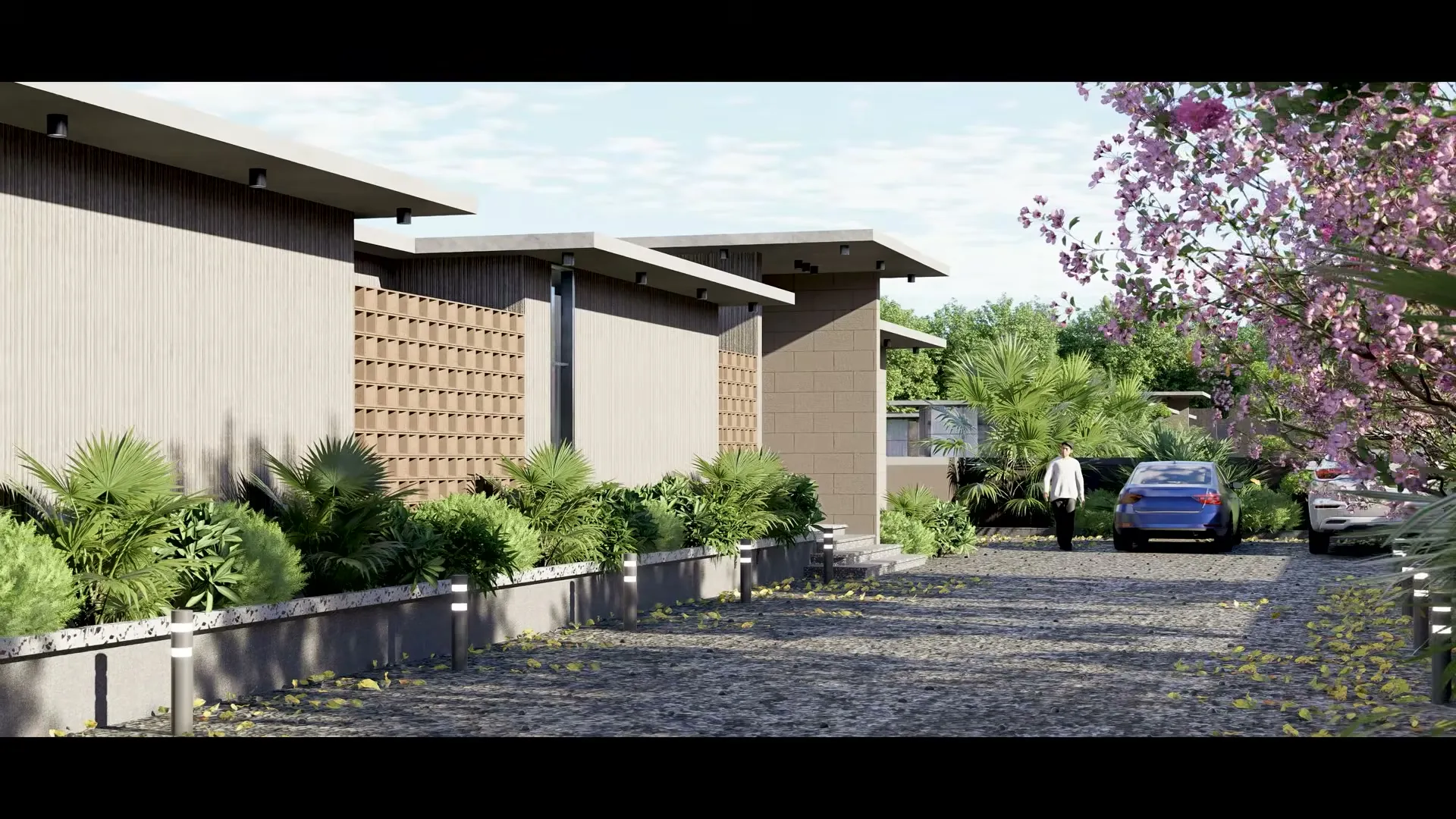 Exterior of a villa at Tranquil Farms showing the perforated jaali screen and cantilevered roof