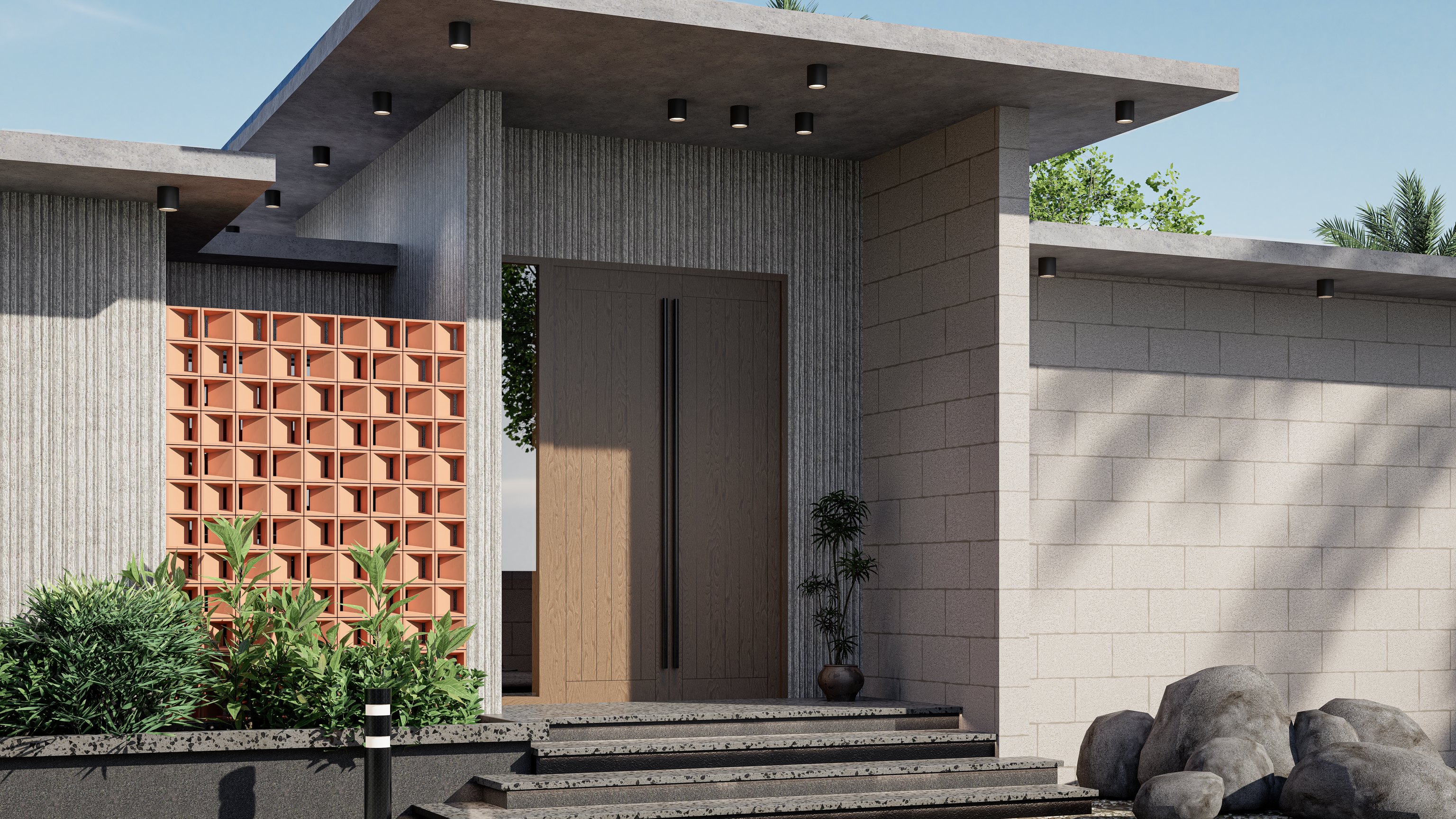 The villa entrance with stone steps and terracotta jaali blocks